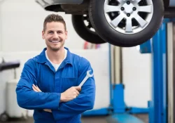 Mechanic giving keys to woman in car